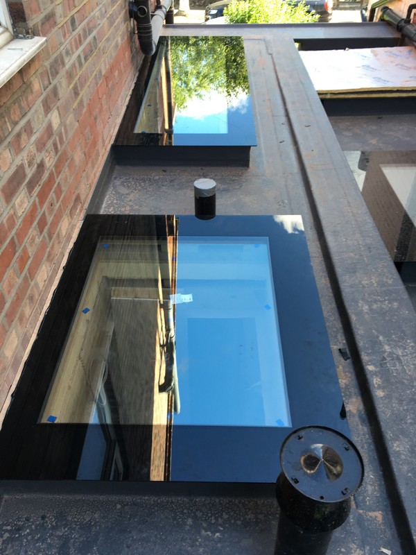 Multiple flat roof skylights on extension in Olympic Park